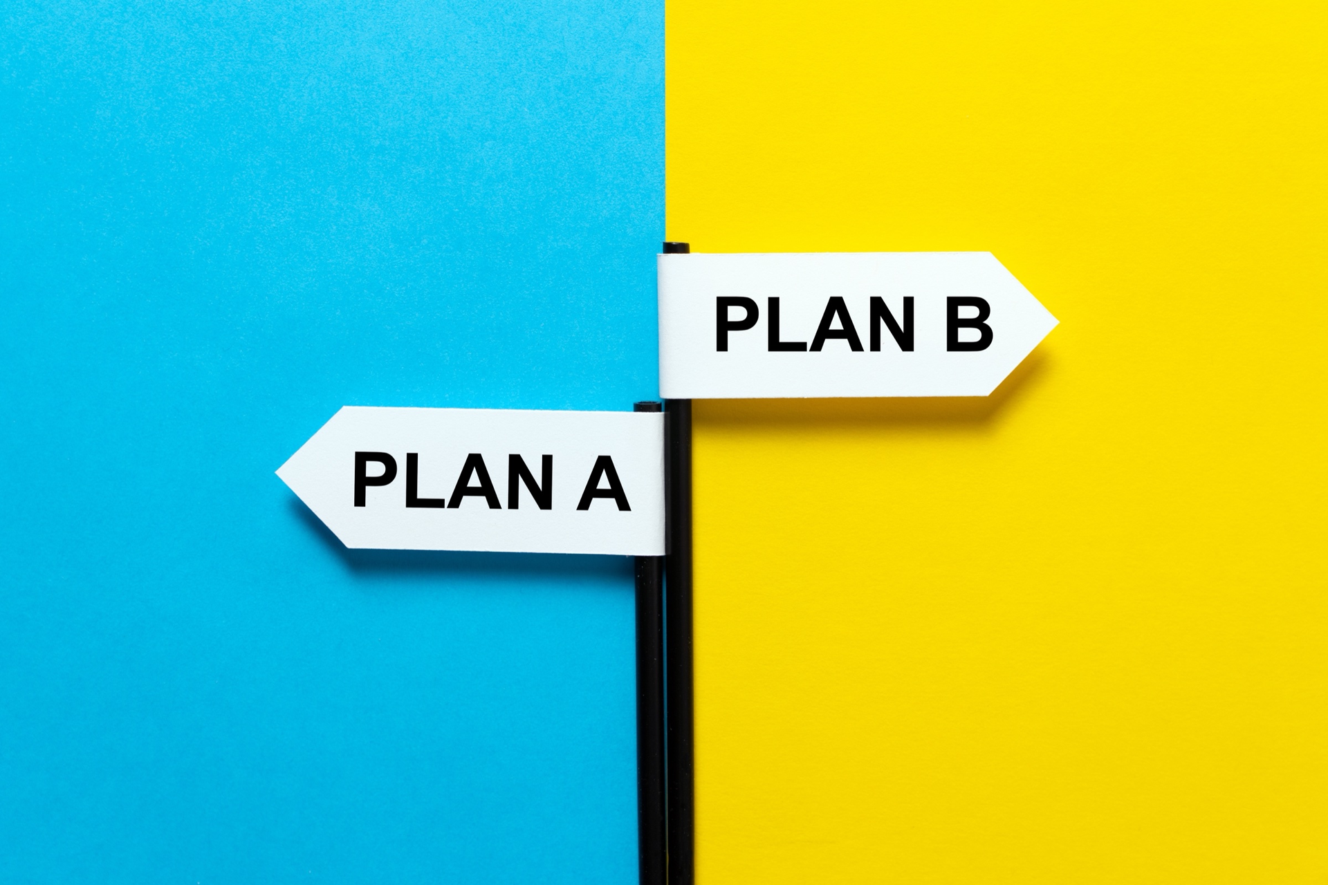 Two arrow signs labeled Plan A and Plan B pointing in opposite directions