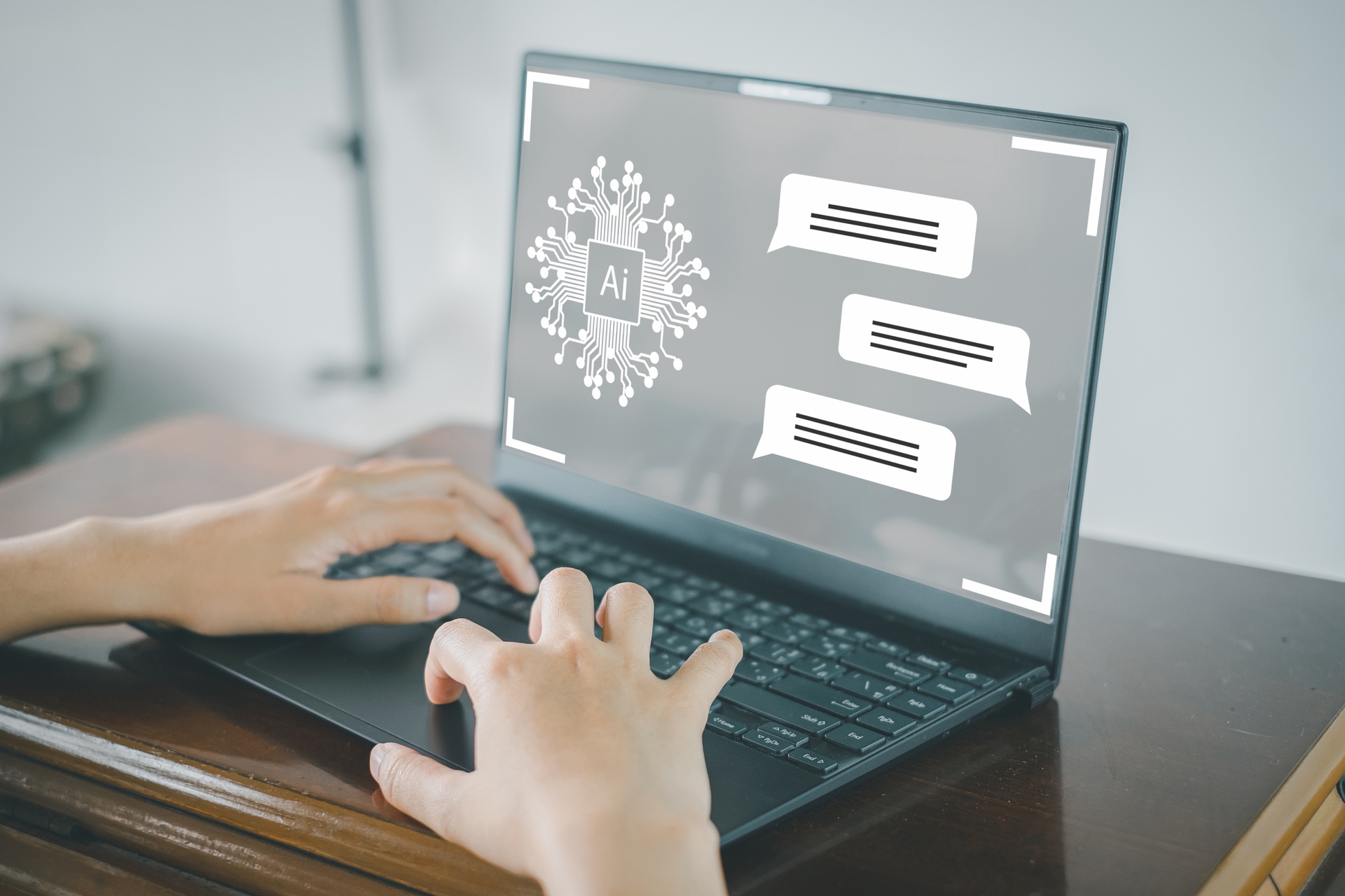 Business owner using an AI assistant chat on a laptop