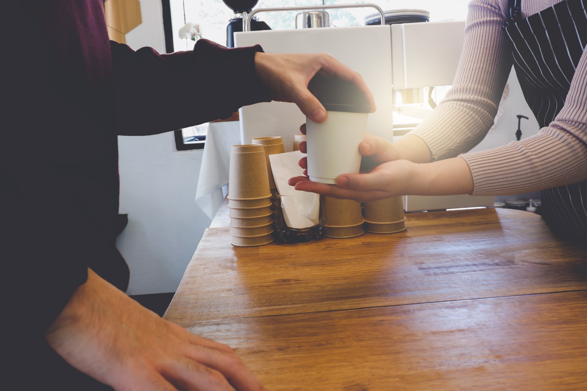 Barista serving coffee